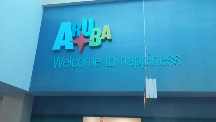 2-welcome to aruba sign on the airport